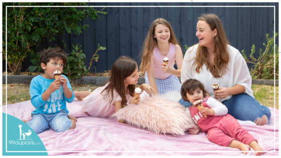 99aupairs-Au-Pair-and-Host-Kids-Having-a-Picnic-Eating-an-Ice-Cream