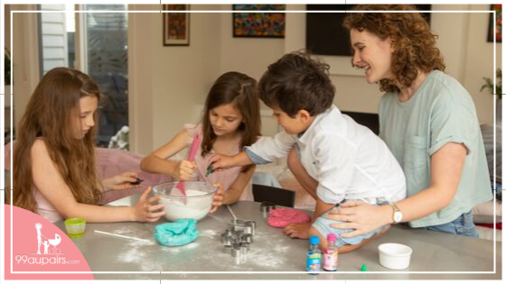 99aupairs-blog-au-pair-watching-australian-host-kids-making-art-having-fun-playing-at-the-kitchen-making-dough